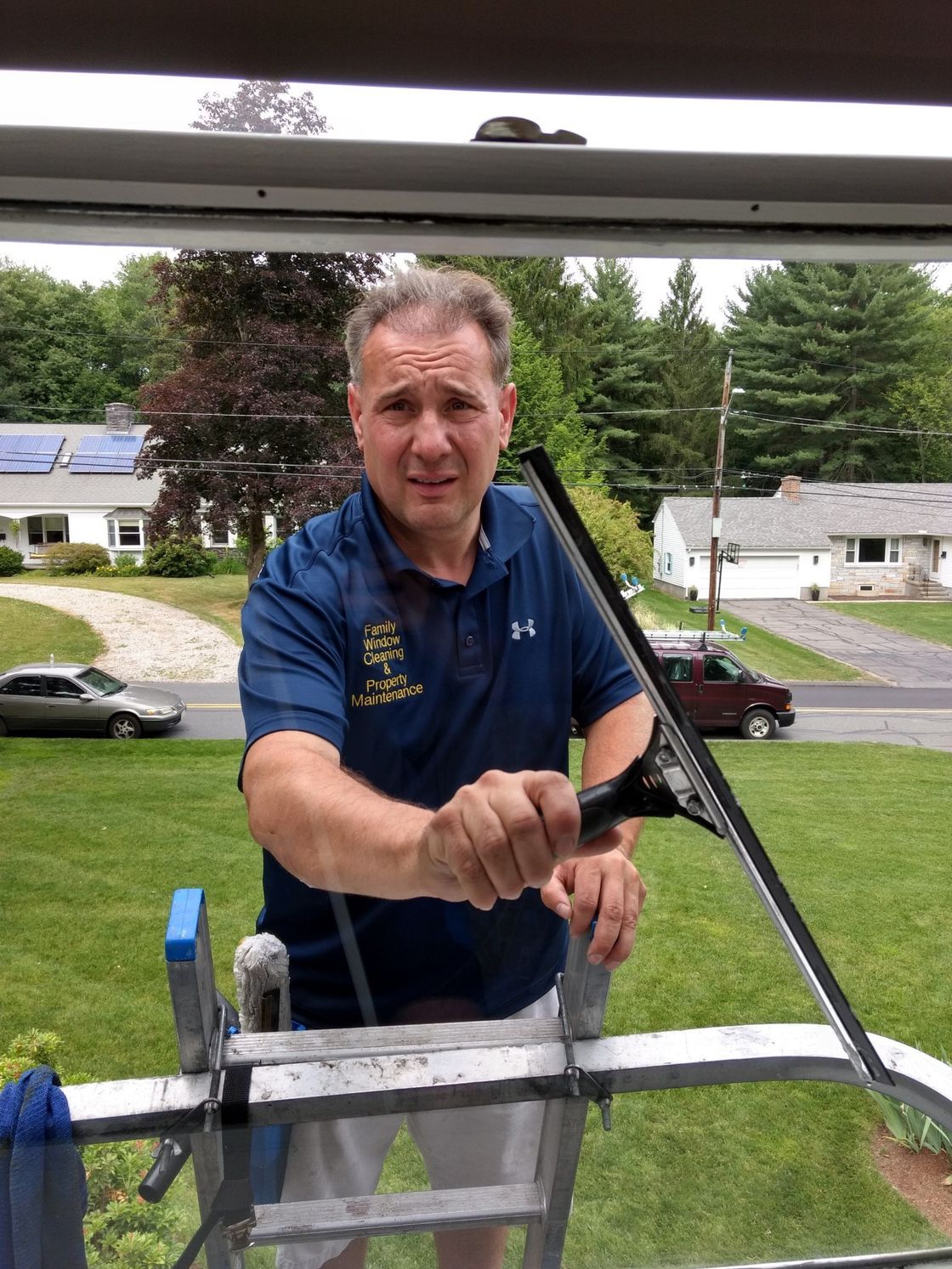 Owner Cleaning Window — Hadley, MA — Family Window Cleaning & Property Maintenance
