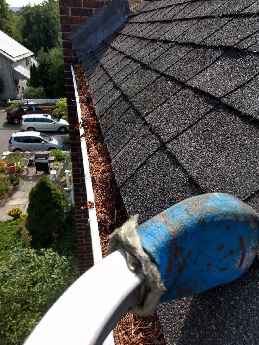 Gutter With Leaves — Hadley, MA — Family Window Cleaning & Property Maintenance