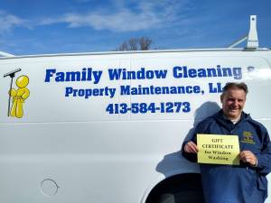 FWC Posing On Company Truck With Gift Certificate — Hadley, MA — Family Window Cleaning & Property Maintenance