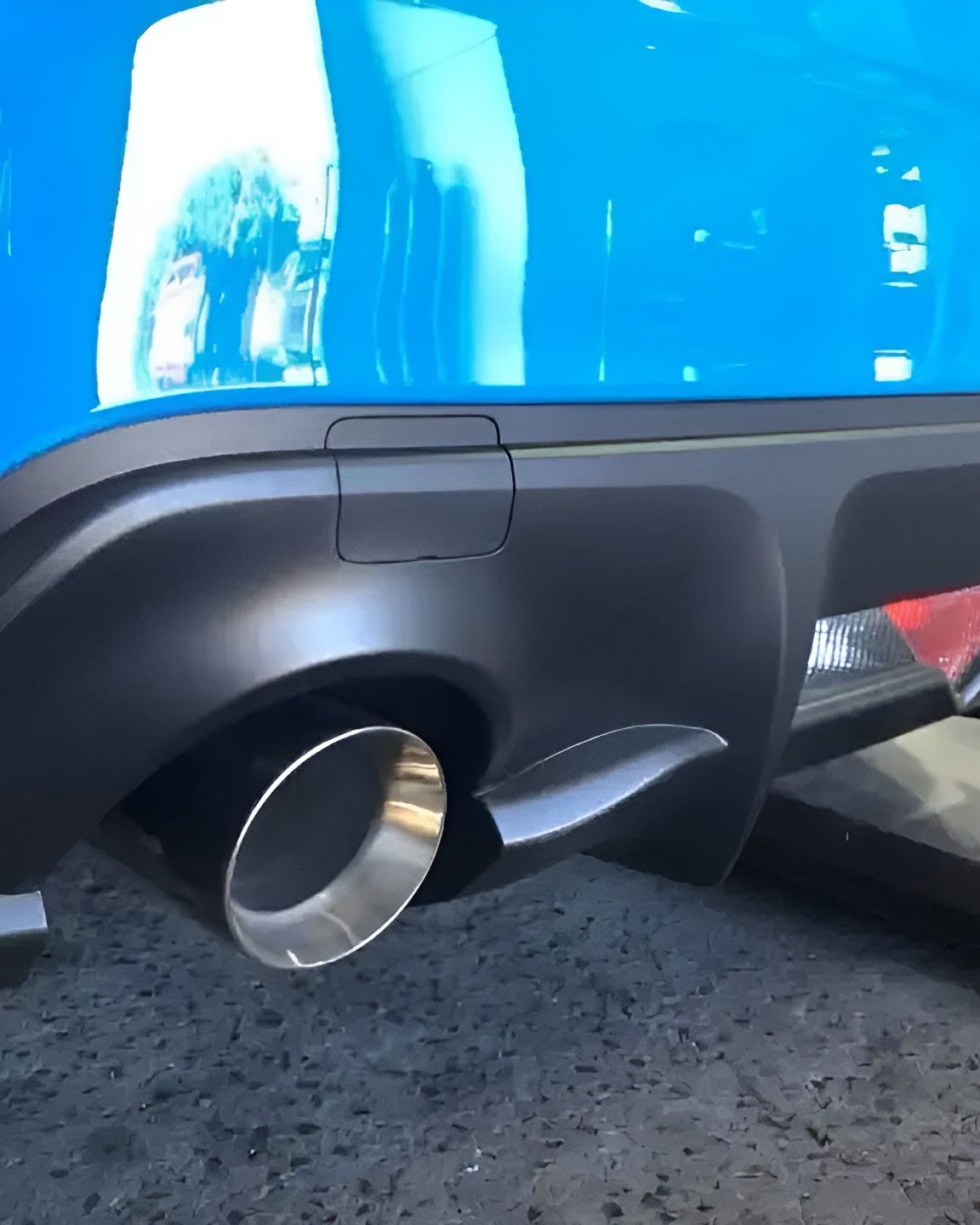 A Close Up of a Blue Car's Exhaust Pipe — Ace Exhaust Centre in Berserker, QLD