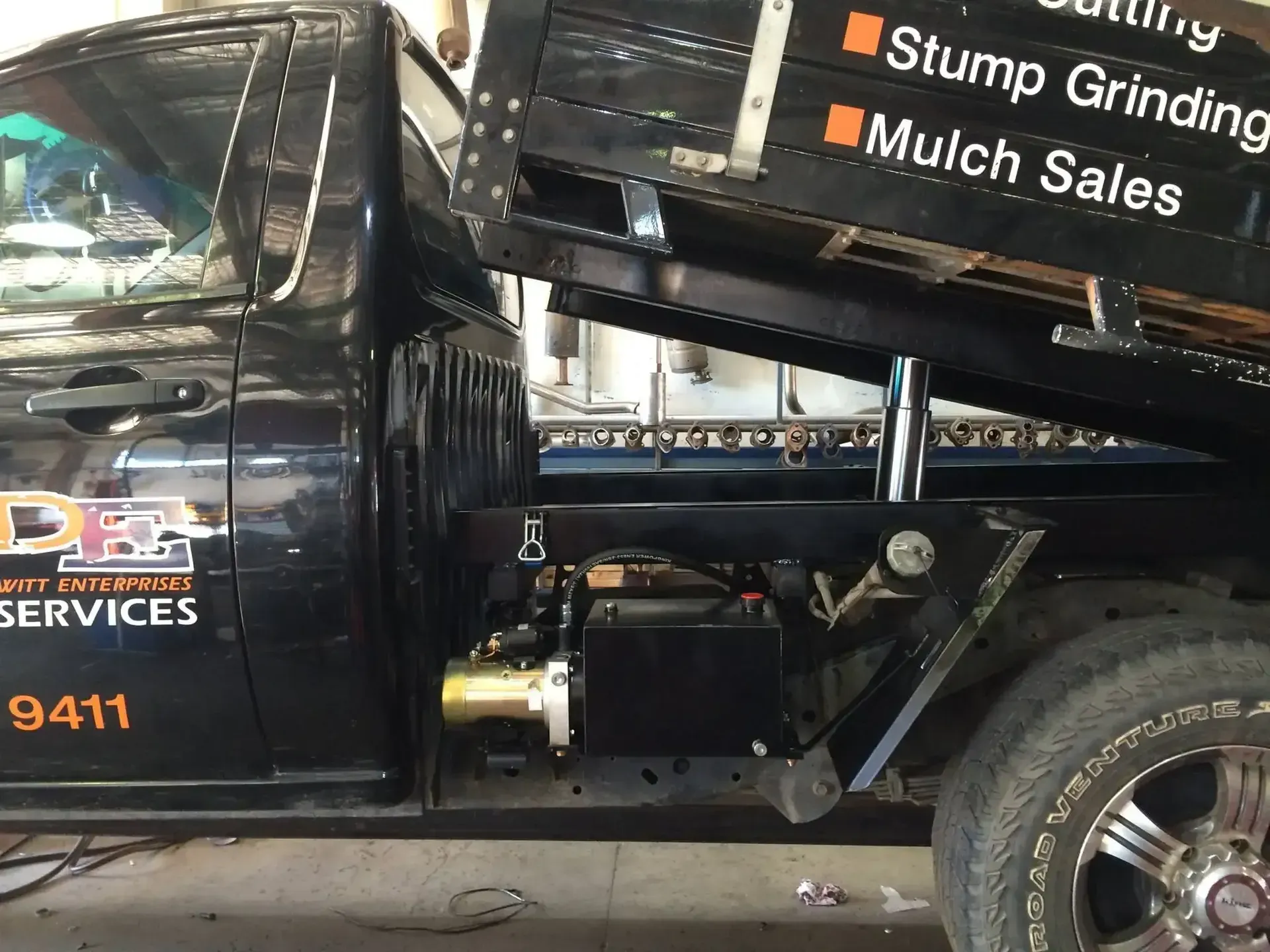 A Black Truck With the Word Mulch Sales on It — Ace Exhaust Centre in Berserker, QLD