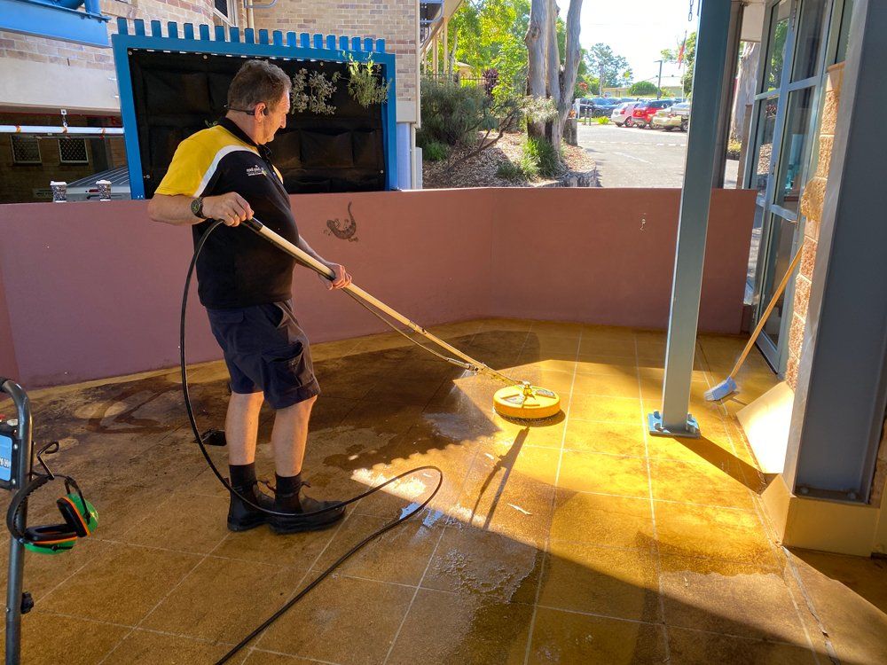 Workers Cleaning Outdoor Tiles & Grout — Commercial Cleaning in Casino, NSW