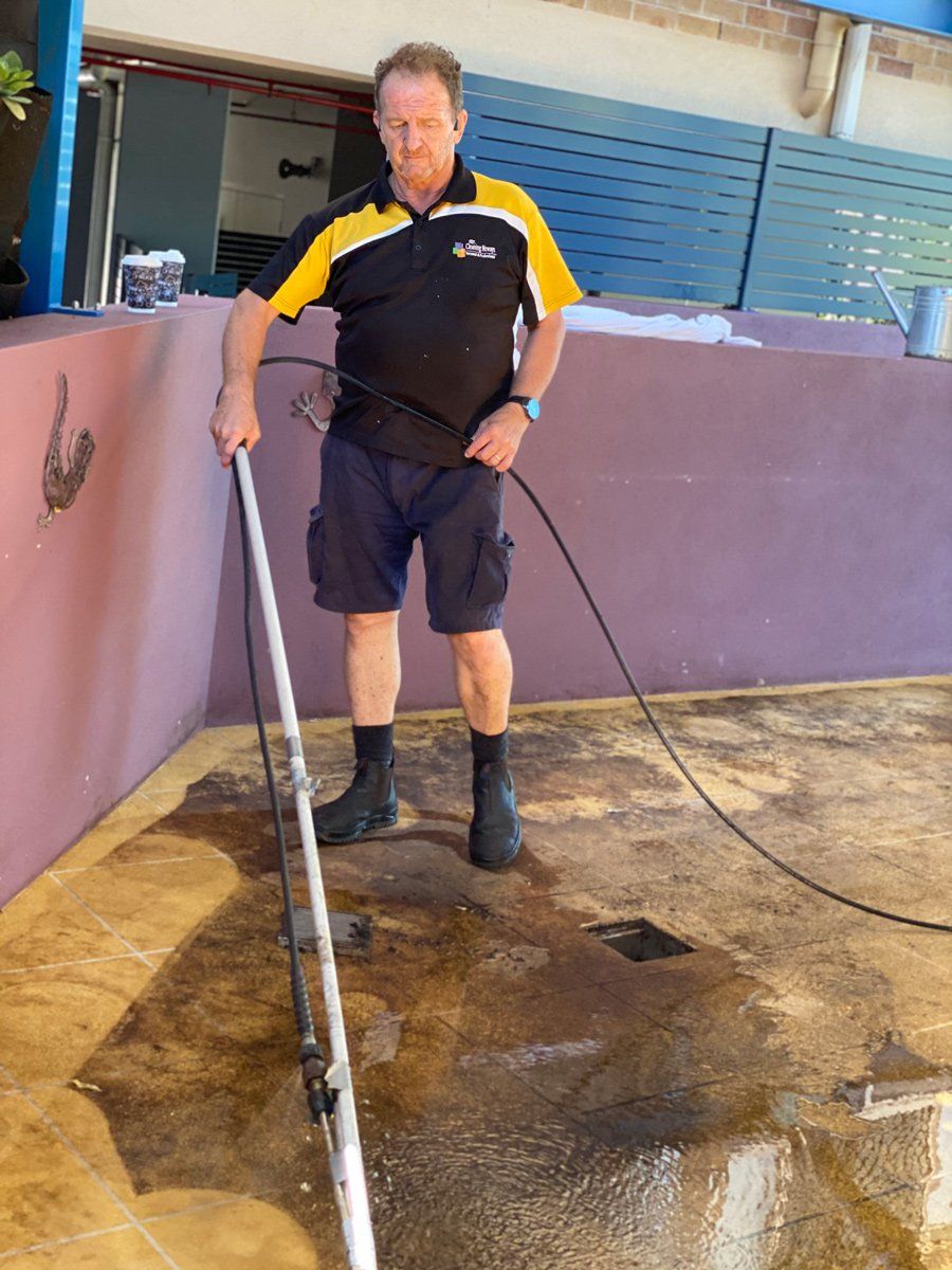 Cleaner Pressure Washing Outdoor Tiles — Commercial Cleaners in Ballina