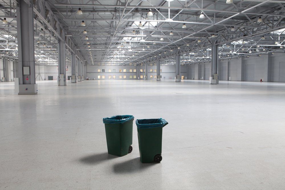 Two Dustbins In Large Modern Storehouse — Construction Cleaning in Casino, NSW