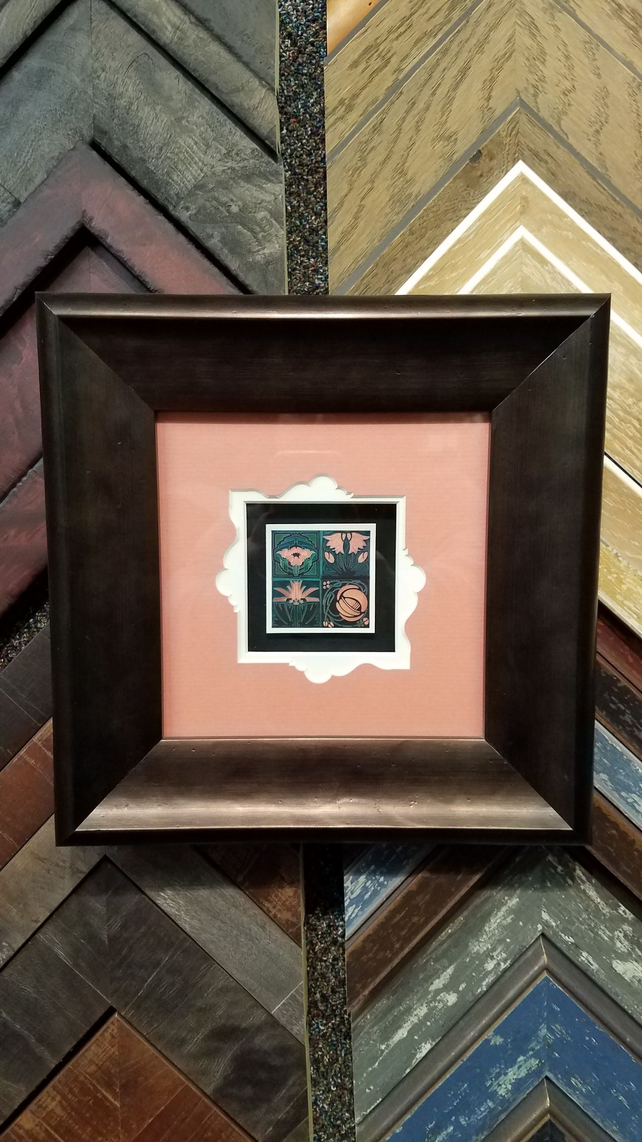 A picture frame with a picture inside of it is hanging on a wall.