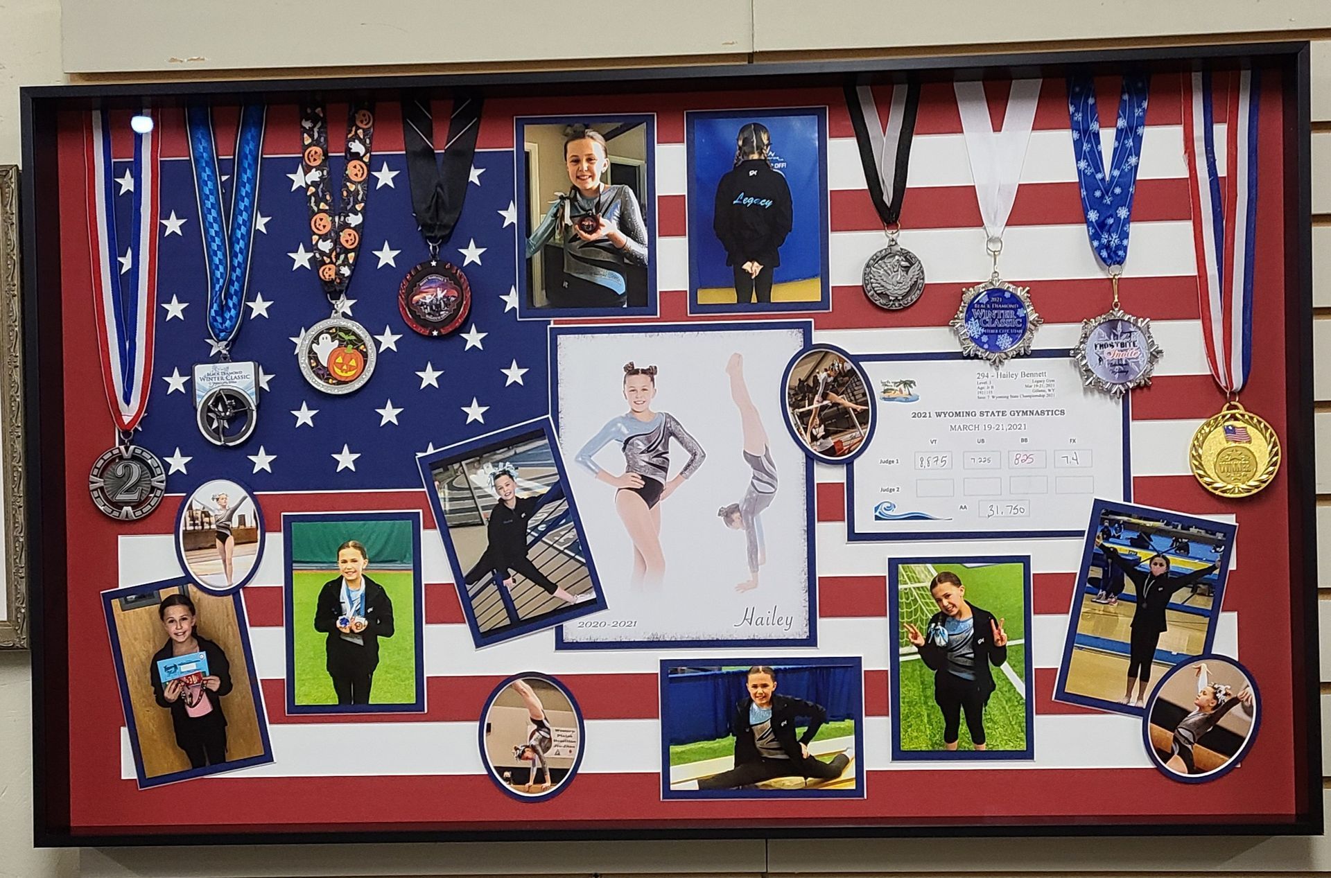 A display of medals and pictures on an american flag background