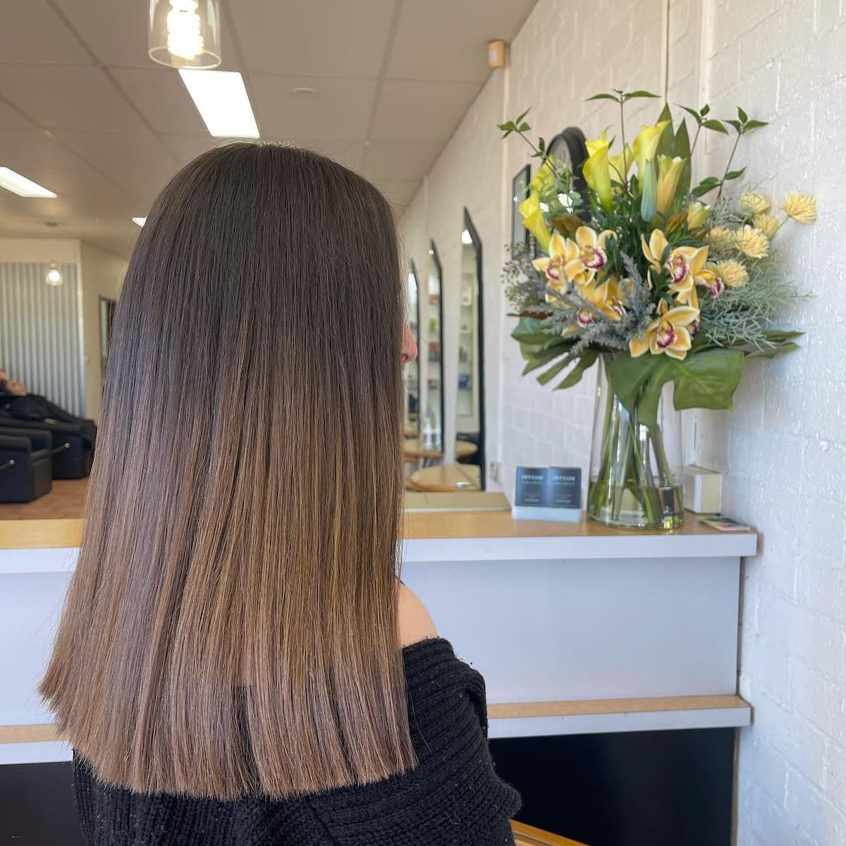 A Person With Medium-length Brown Crimped Hair, Facing Away From the Camera — Devyani Hair & Beauty in Unanderra, NSW