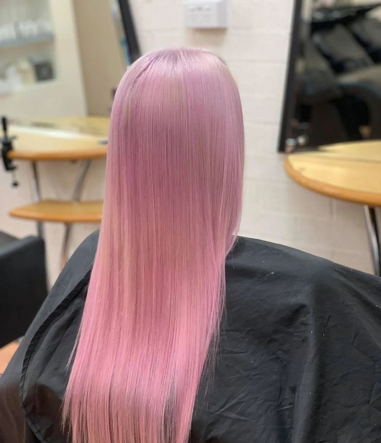 Long, Straight Hair Dyed a Soft Pastel Pink — Devyani Hair & Beauty in Unanderra, NSW