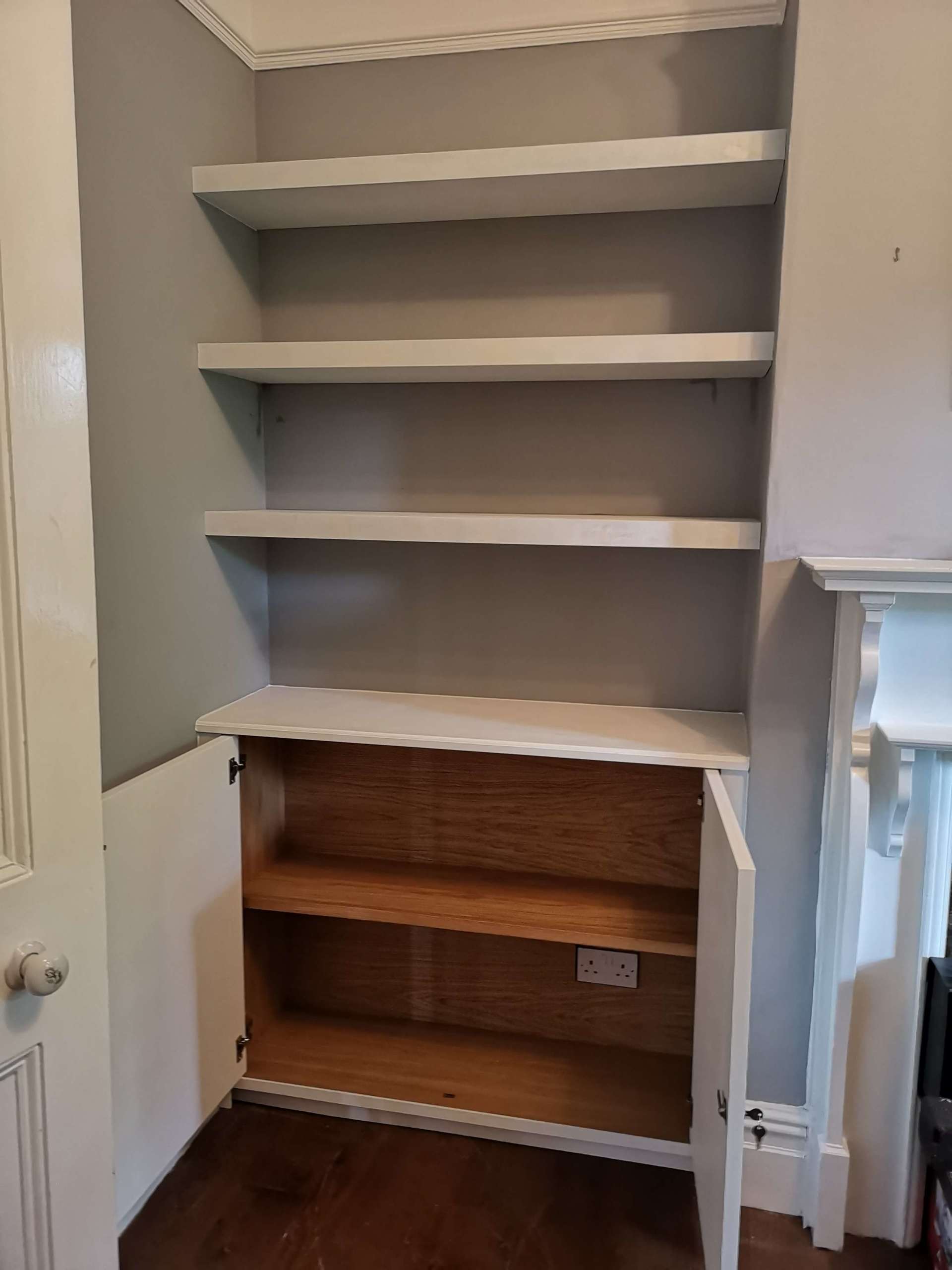 Alcove unit with oak veneer internals, floating shelves and shaker beaded doors.  Painted white