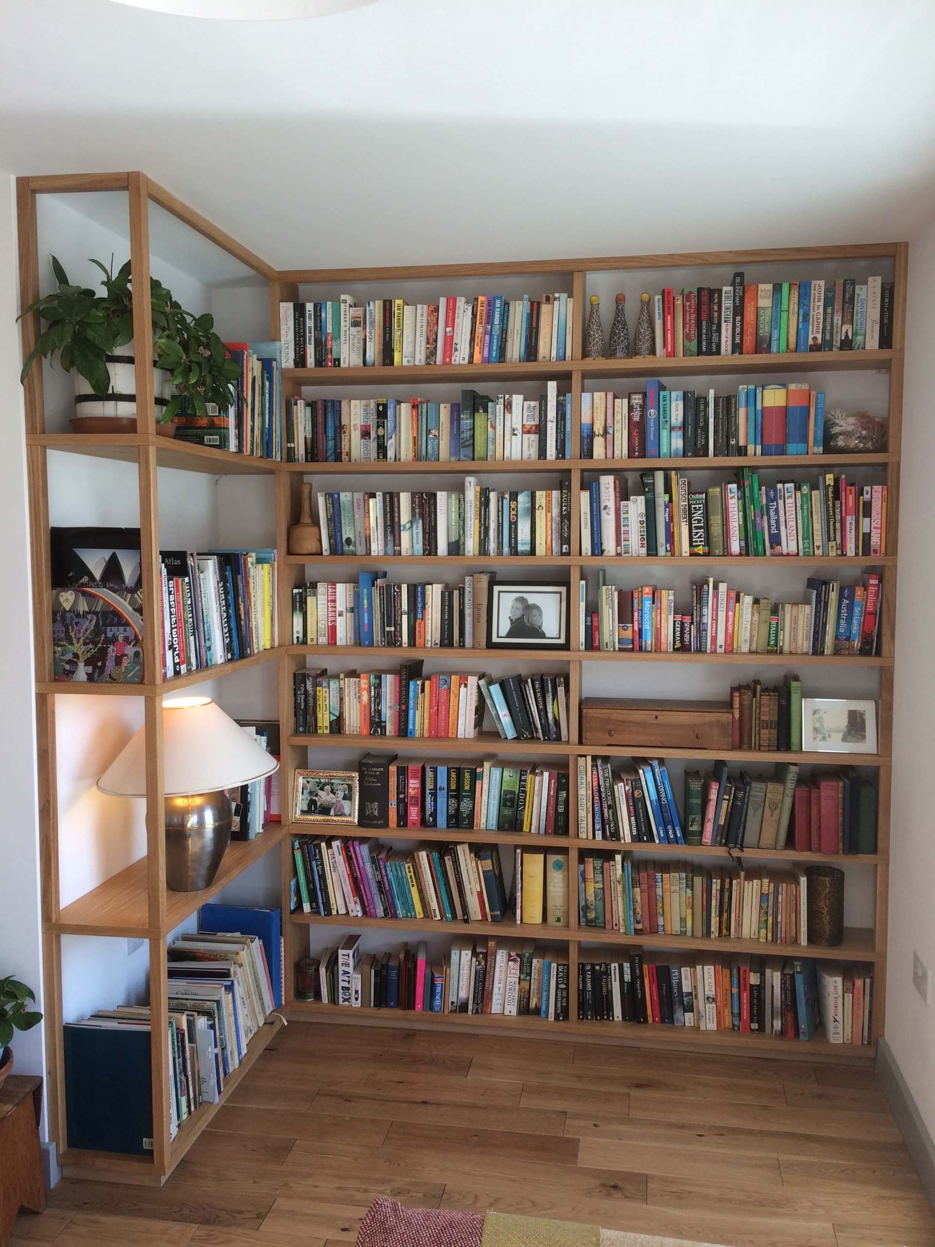 Large oak veneer book shelves corner unit. Fitted to wall and finished with Hard wax oil