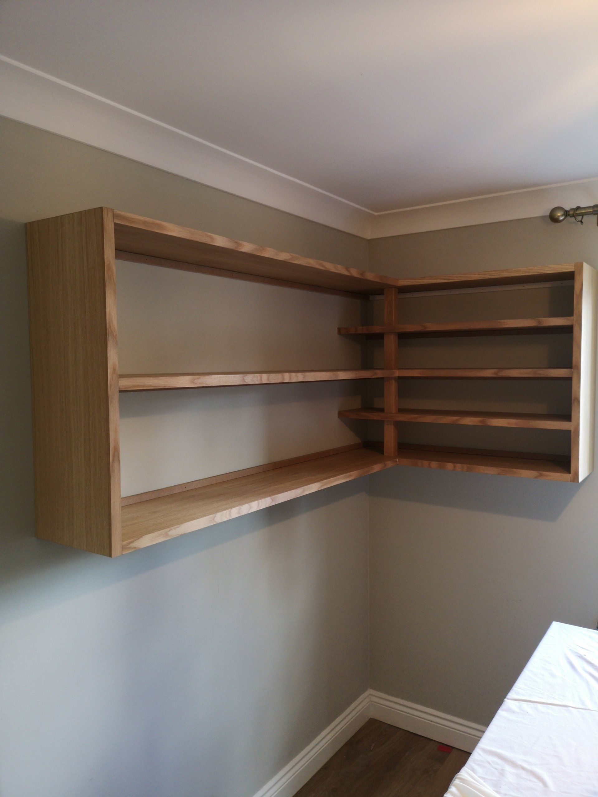 Oak veneer corner shelving unit finished with Fiddes hardwax oil.