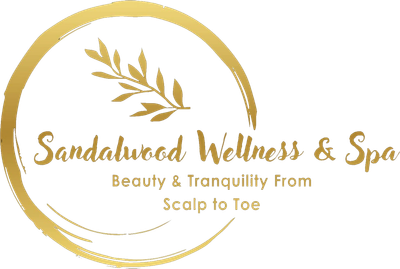 Logo for Sandalwood Wellness & Spa: Gold circle and leaves frame text, 