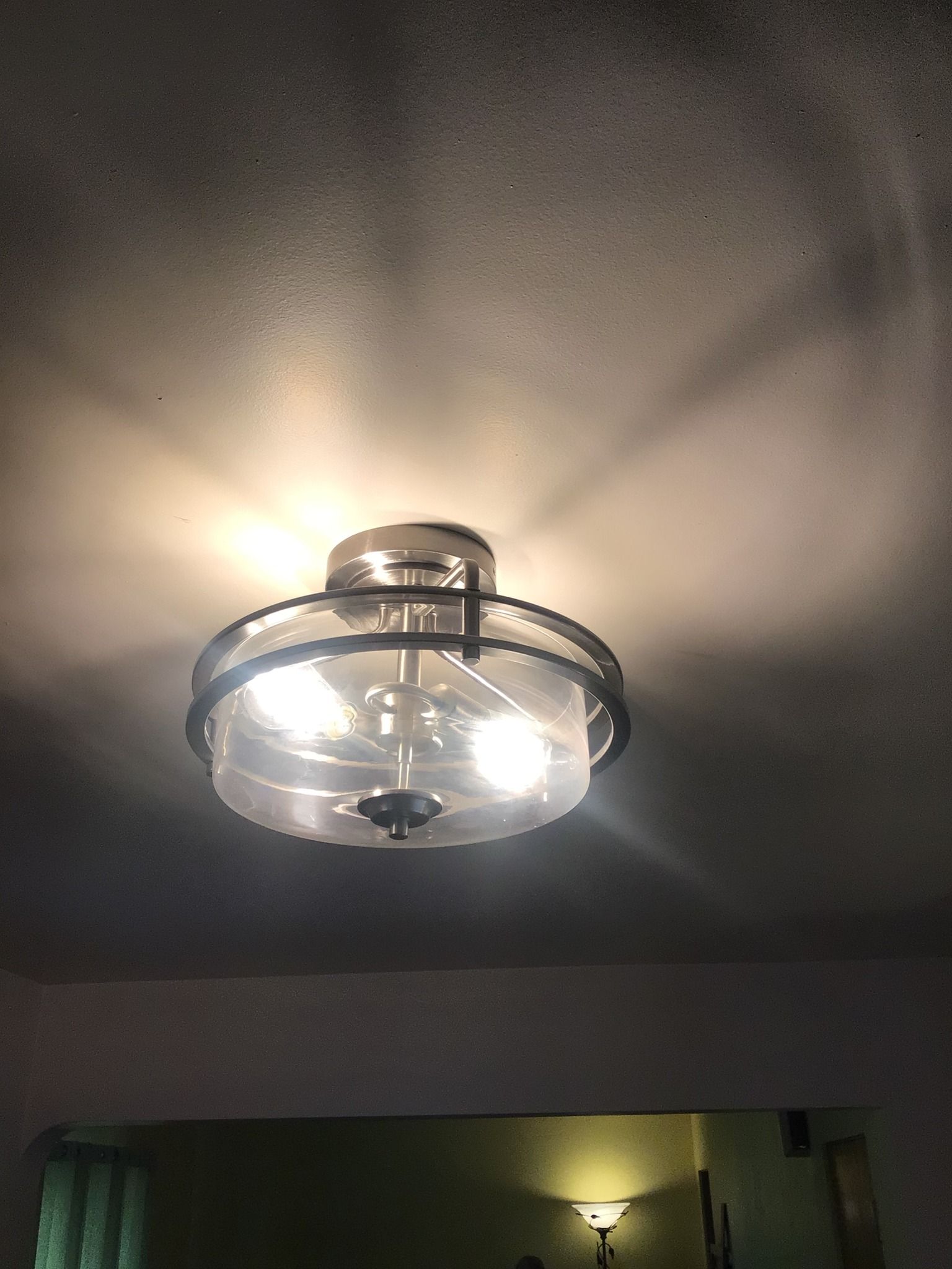 A ceiling fan is hanging from the ceiling in a living room.