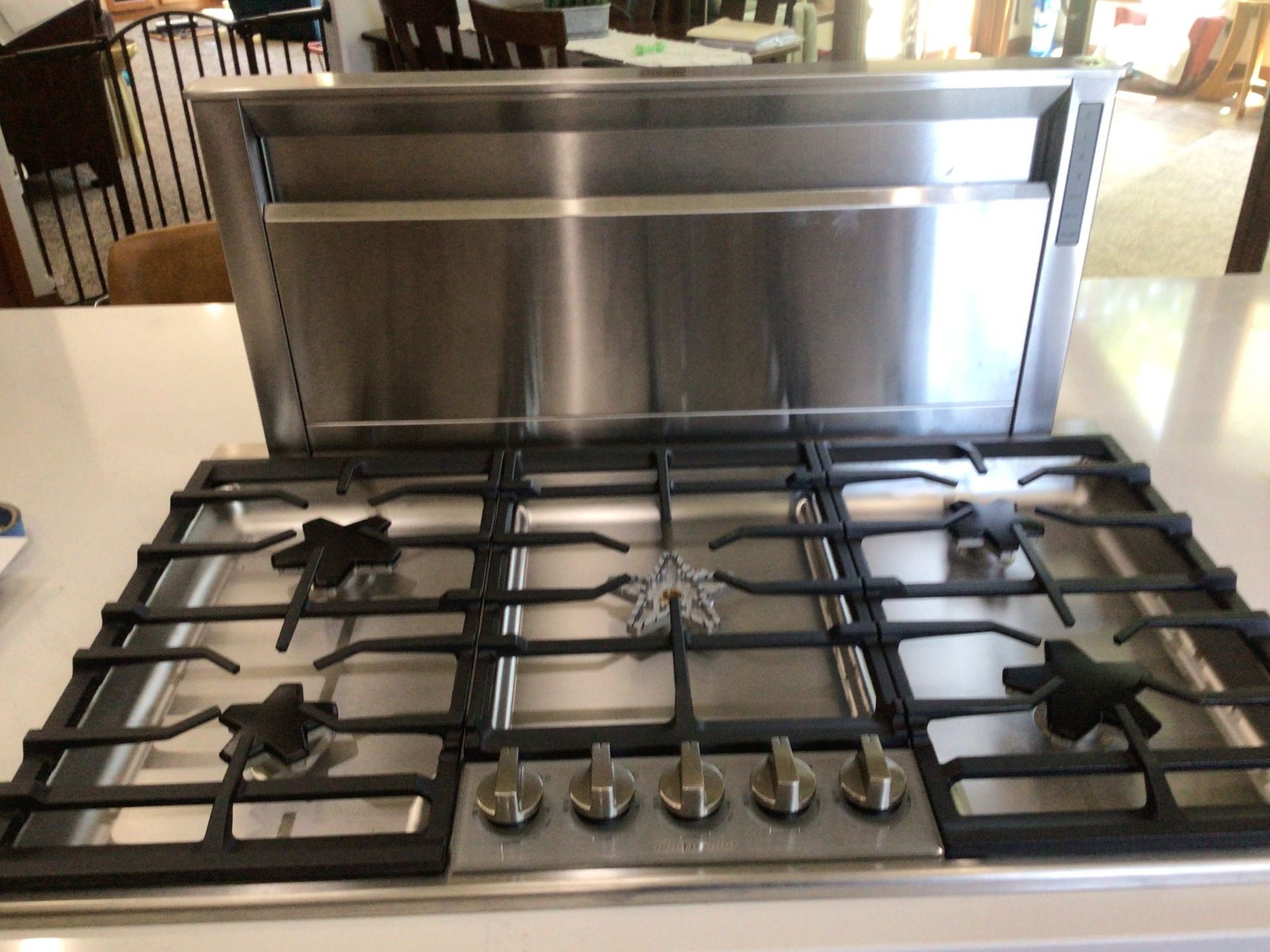 A stainless steel stove top oven is sitting on a counter