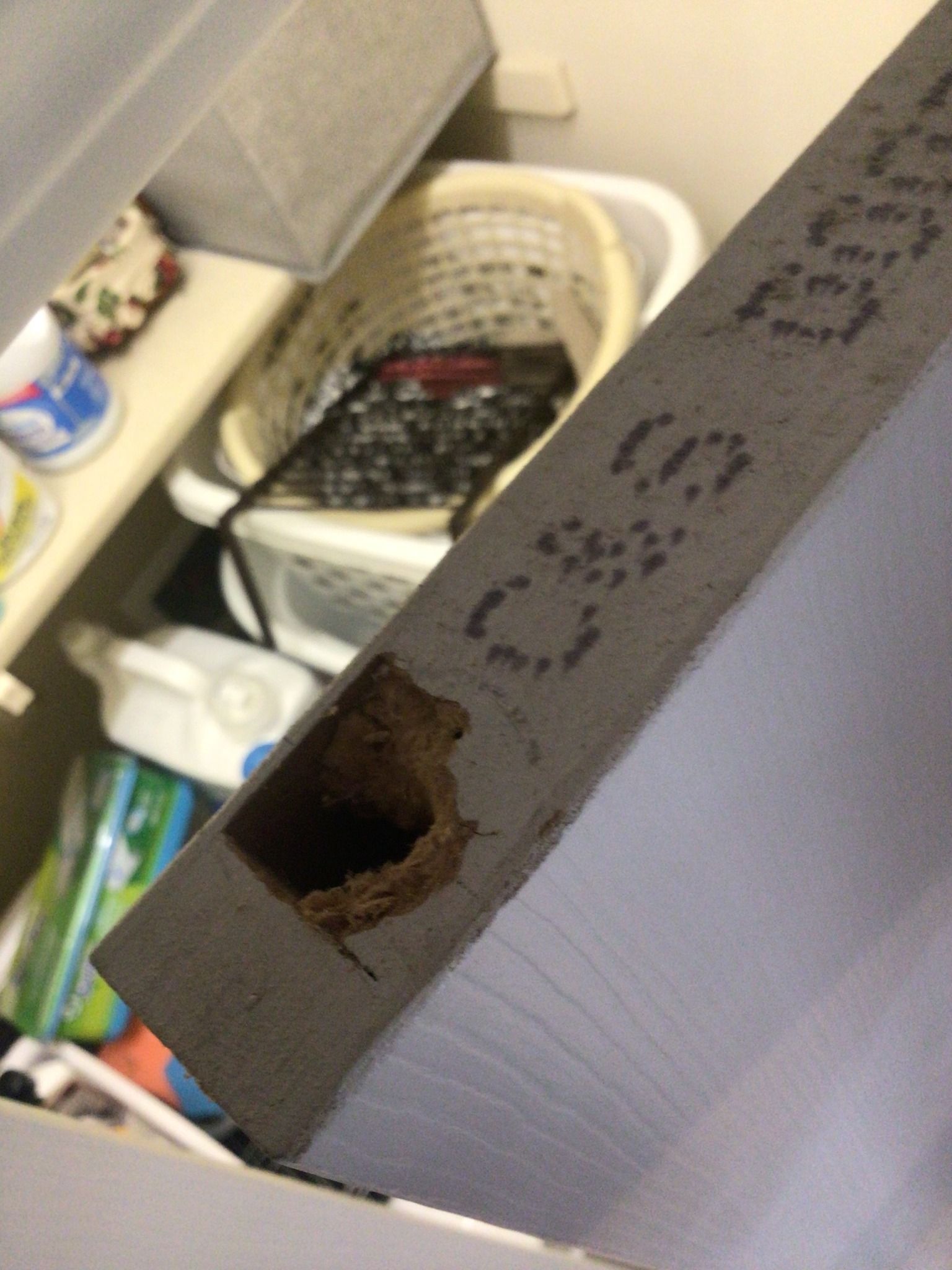 A box with a hole in it that says ' very ' on it