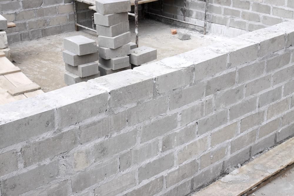 Concrete Brick Wall Built On A Construction Site — Tuscany Concreting In Cannonvale, QLD