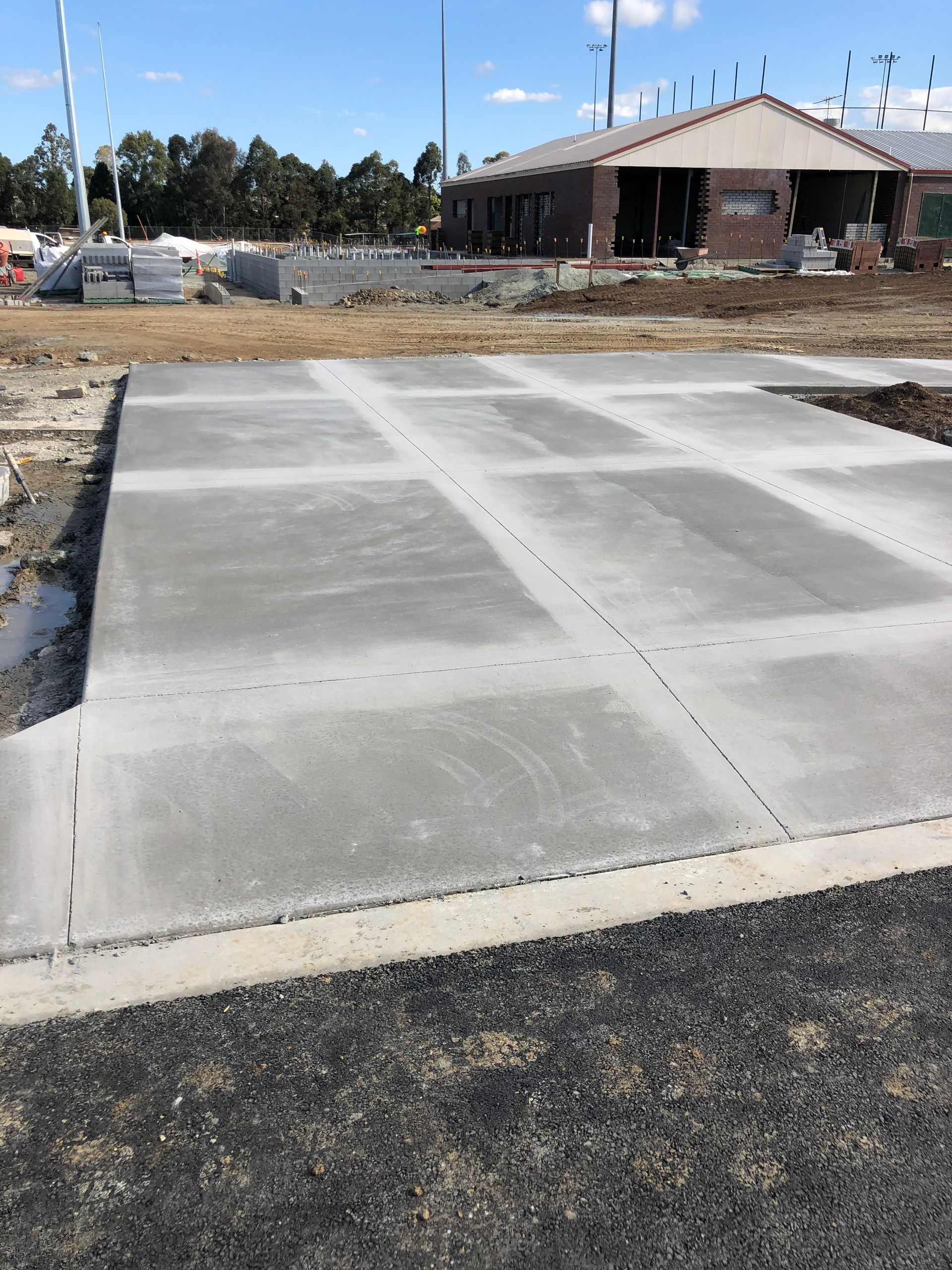 A Group Of Construction Workers Are Working On A Construction Site — Tuscany Concreting In Airlie Beach, QLD