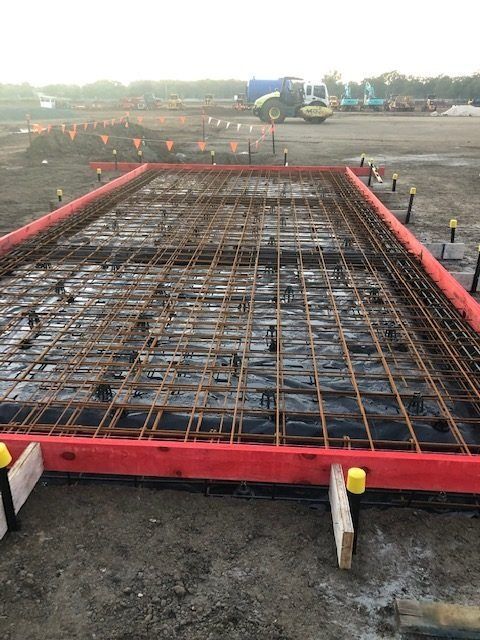 A Concrete Slab Is Being Built On A Construction Site — Tuscany Concreting In Airlie Beach, QLD