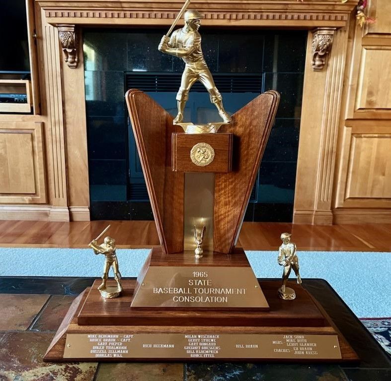 A large wood and gold-tone 1965 State Baseball Tournament consolation trophy featuring three baseball player figures.
