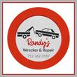 Randy's Wrecker & Repair logo: tow truck towing a car. Red and white circle with phone number.