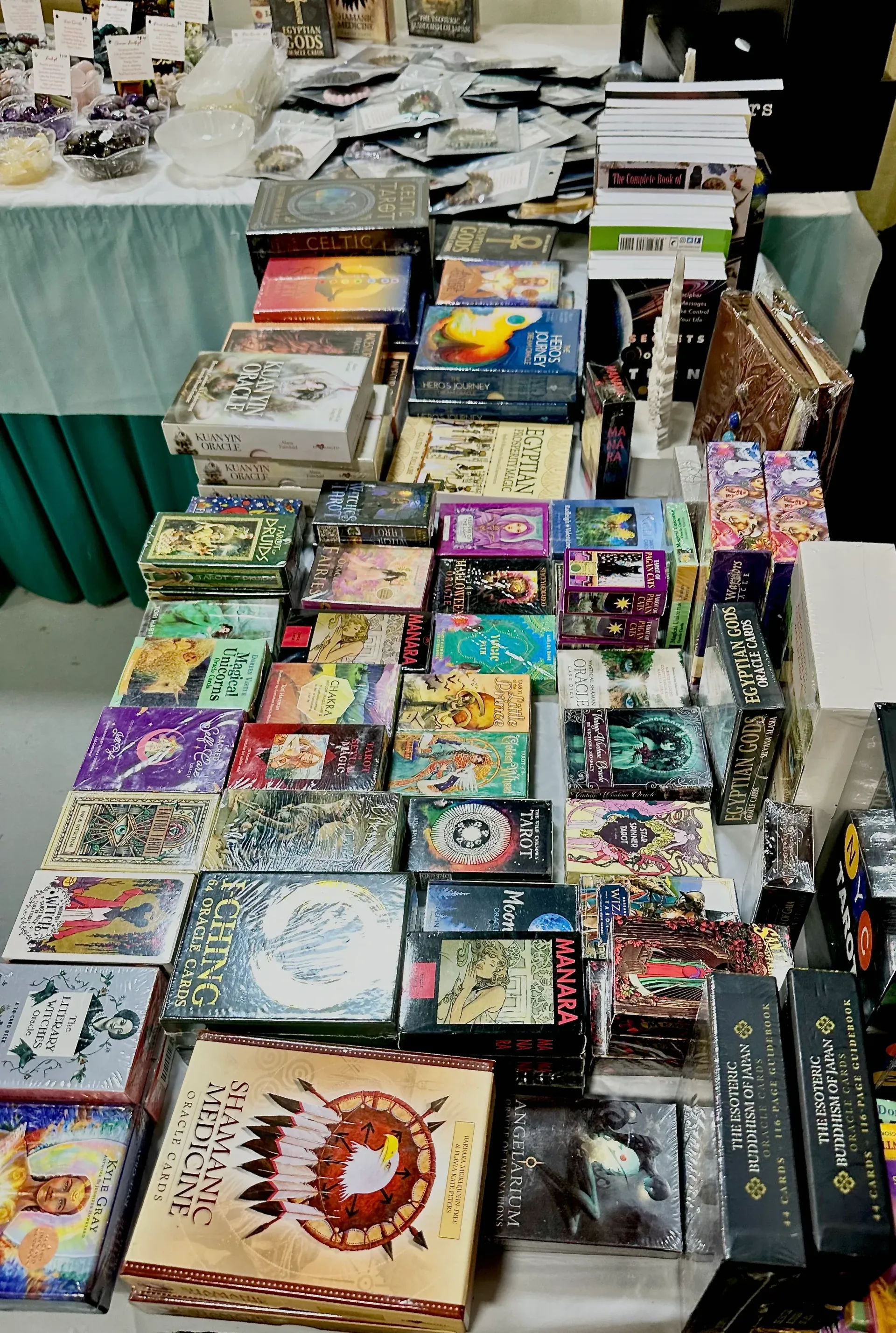 Table of colorful manga and comic books at a convention booth
