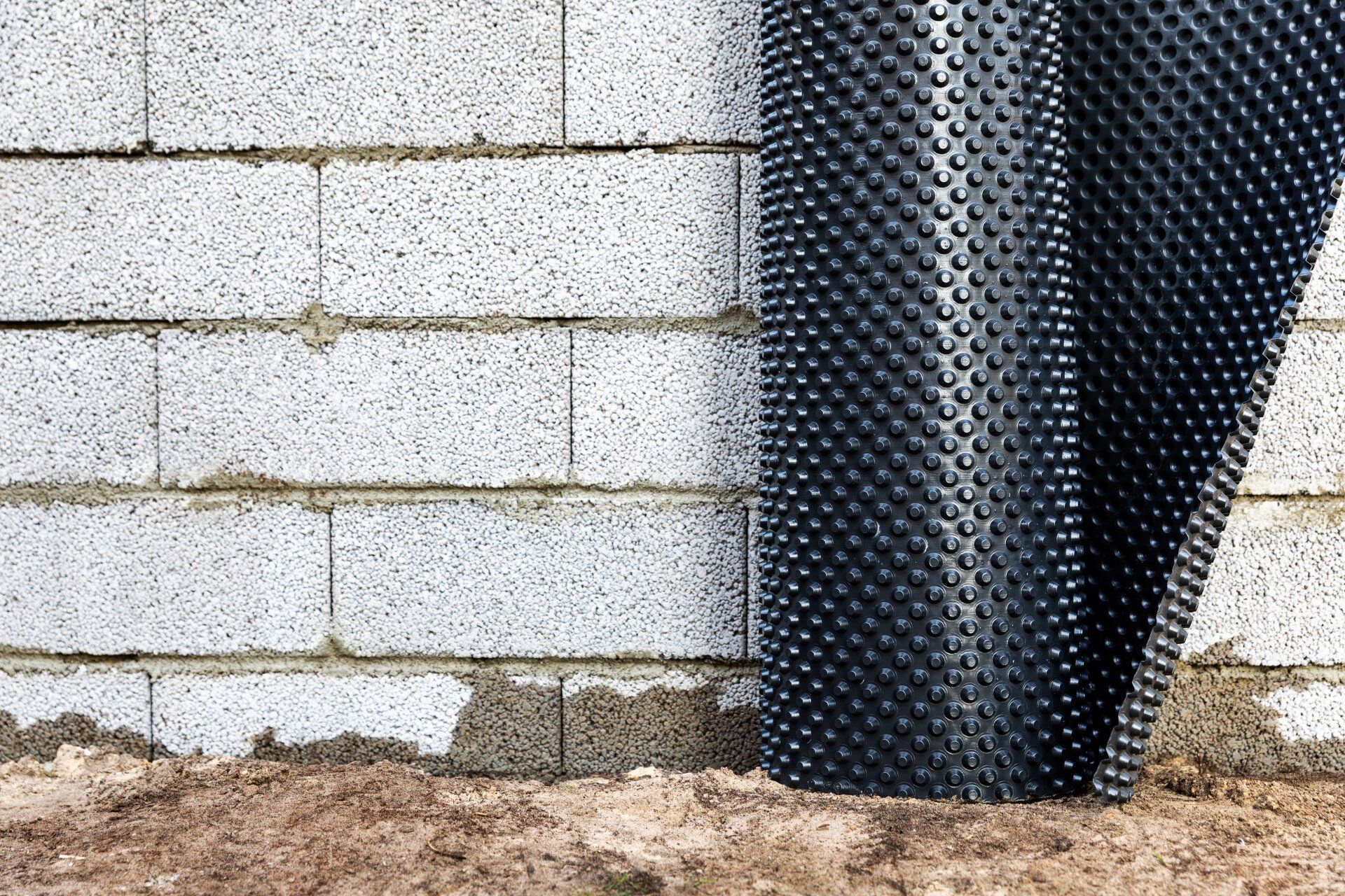 Basement wall waterproofing