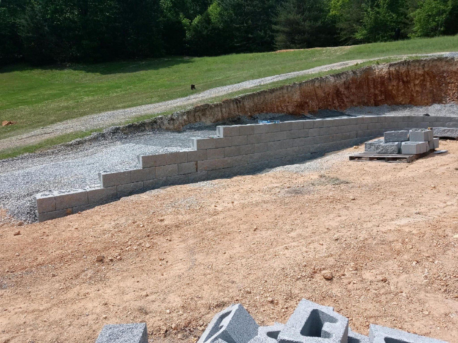Concrete blocks beside an in progress wall