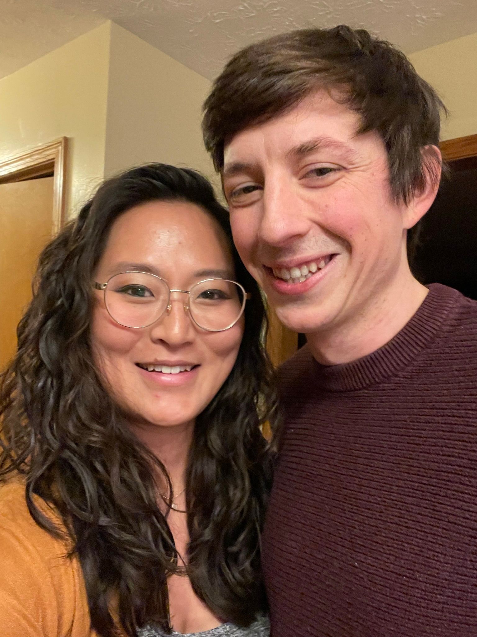 Family posing in front of Cinderella Castle at Disney World.