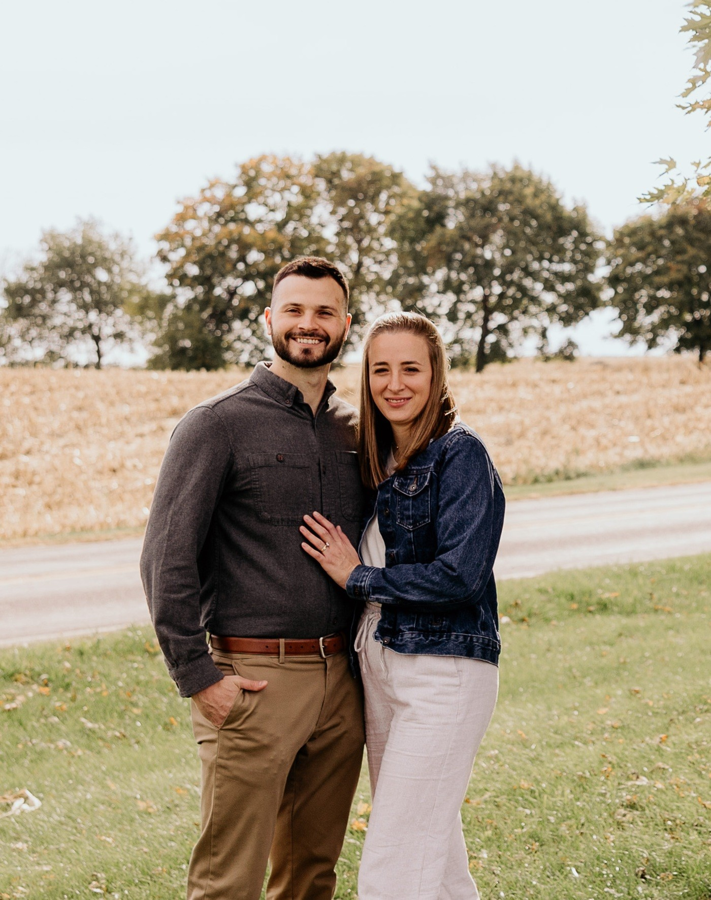 Family posing in front of Cinderella Castle at Disney World.