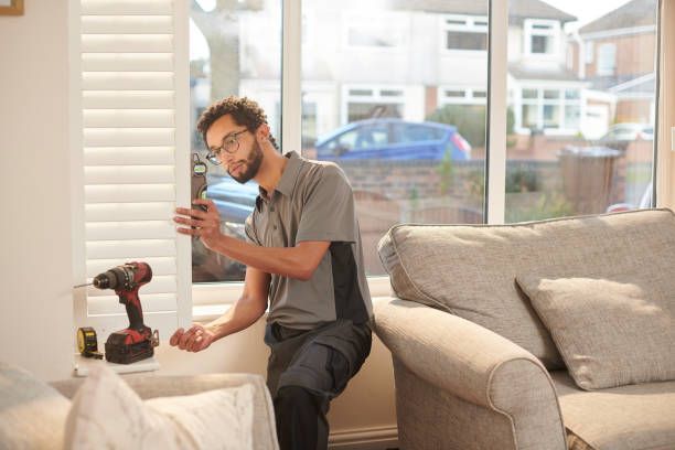 Clean-lined white window treatments offering privacy and light control in a contemporary interior with purple accents.
