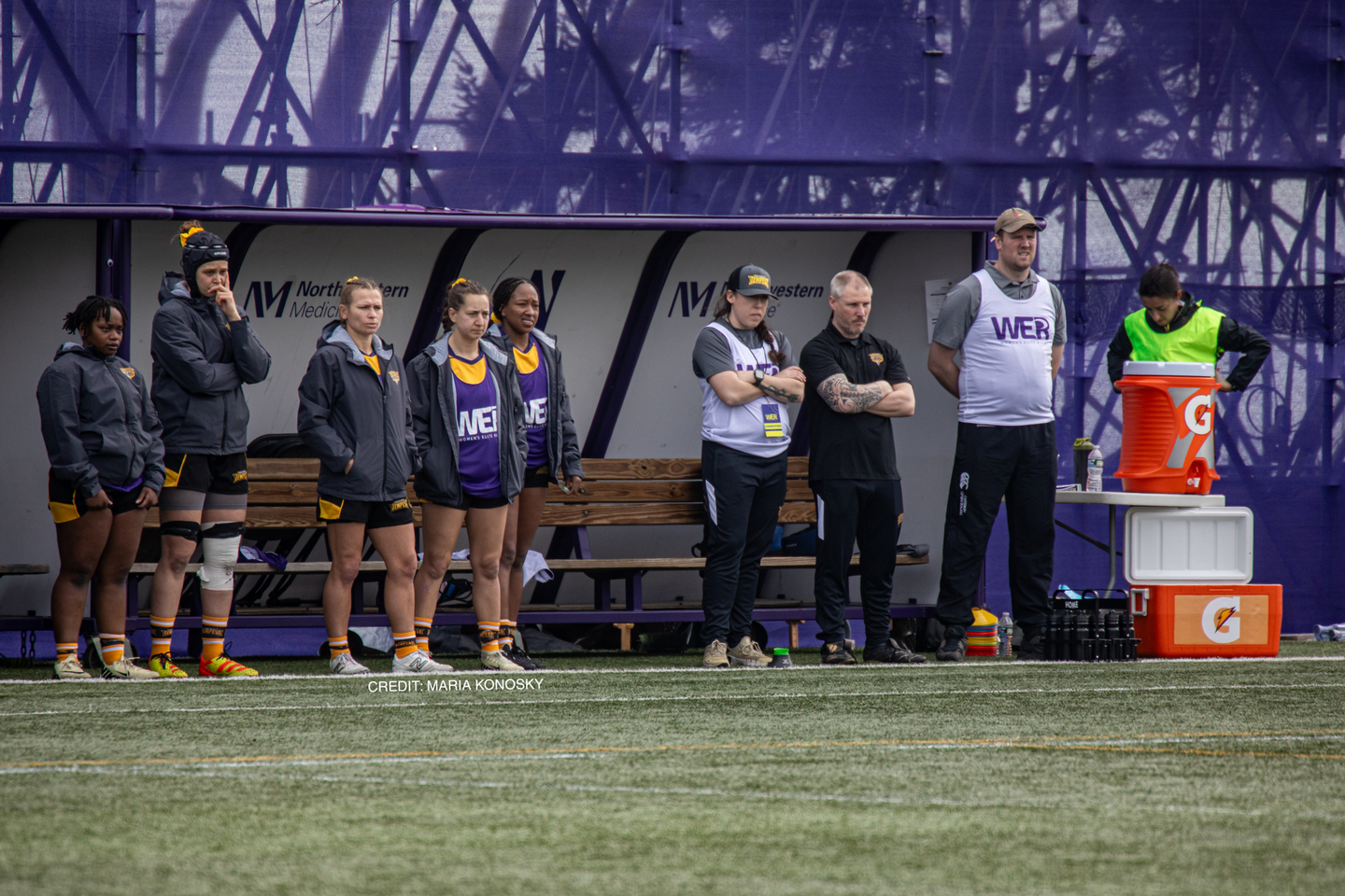 Tempest players and coaches on the sideline