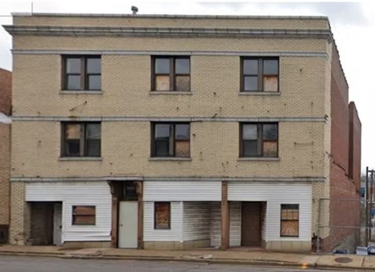 An old brick building with a lot of windows