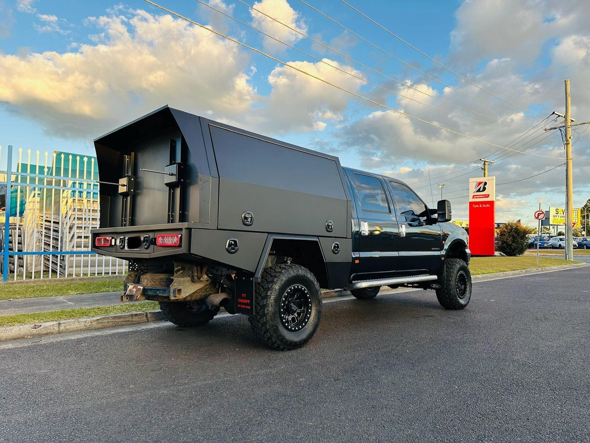 Black Truck With a Custom Utility Body Parked on a Street — PT Canopy In Slacks Creek, QLD
