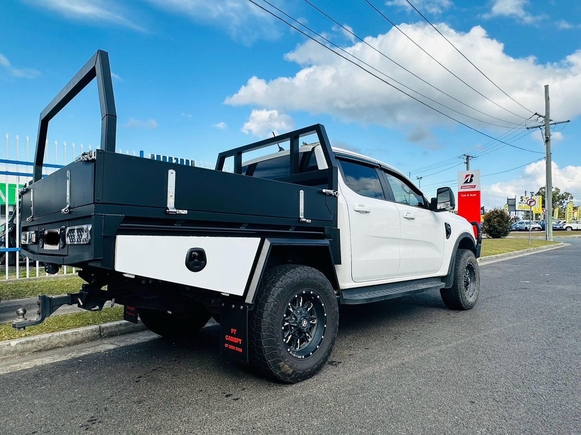 White Ford Ranger Truck With a Black Utility Tray, Parked on a Street — PT Canopy In Slacks Creek, QLD