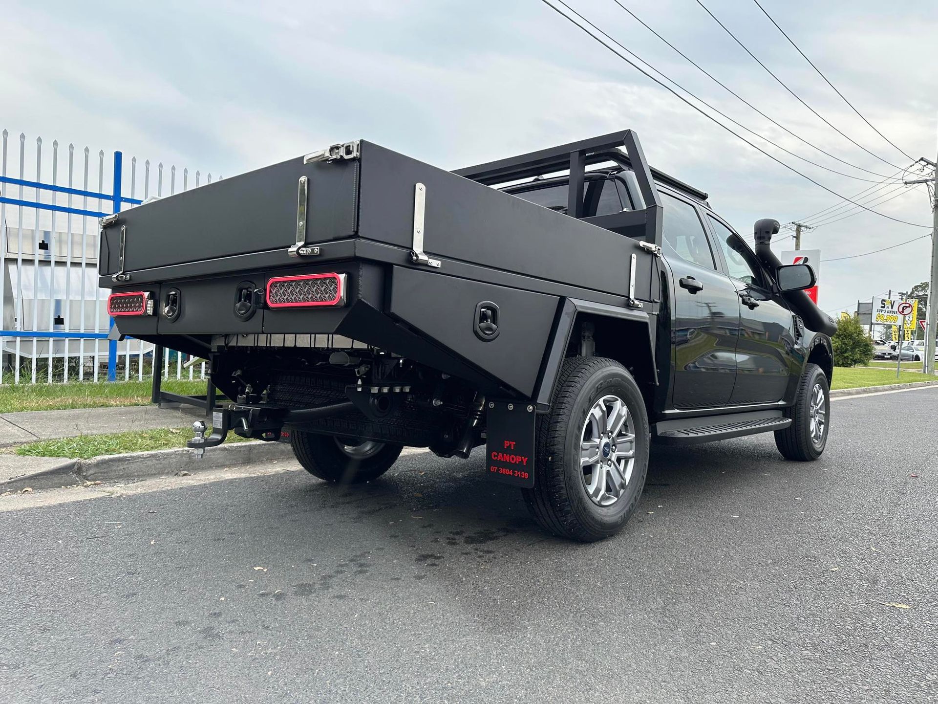 Black Pickup Truck With a Custom Flatbed and Off-road Modifications — PT Canopy In Slacks Creek, QLD