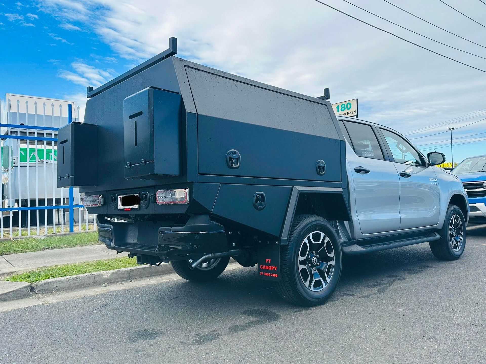 Silver Pickup Truck With a Black, Custom-built Utility Body Parked on a Road — PT Canopy In Slacks Creek, QLD