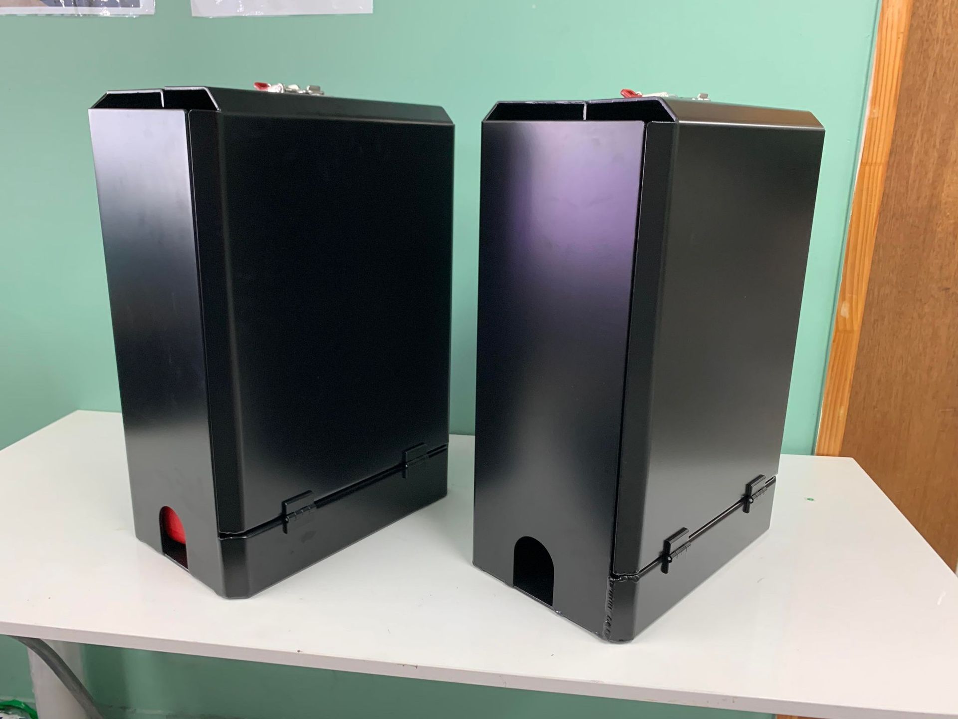 Two Black Rectangular Storage on a White Table — PT Canopy In Slacks Creek, QLD