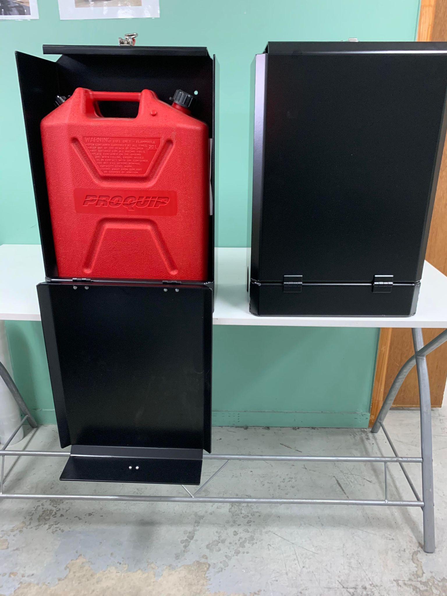Two Black Metal Storage Containers on a White Table — PT Canopy In Slacks Creek, QLD