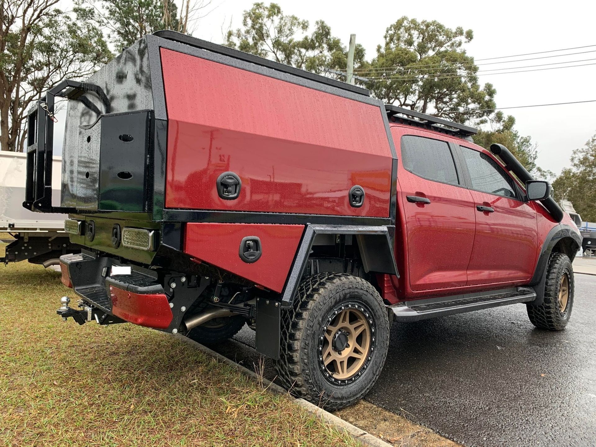 A Maroon Pickup Truck With a Custom Red and Black Utility Bed — PT Canopy In Slacks Creek, QLD