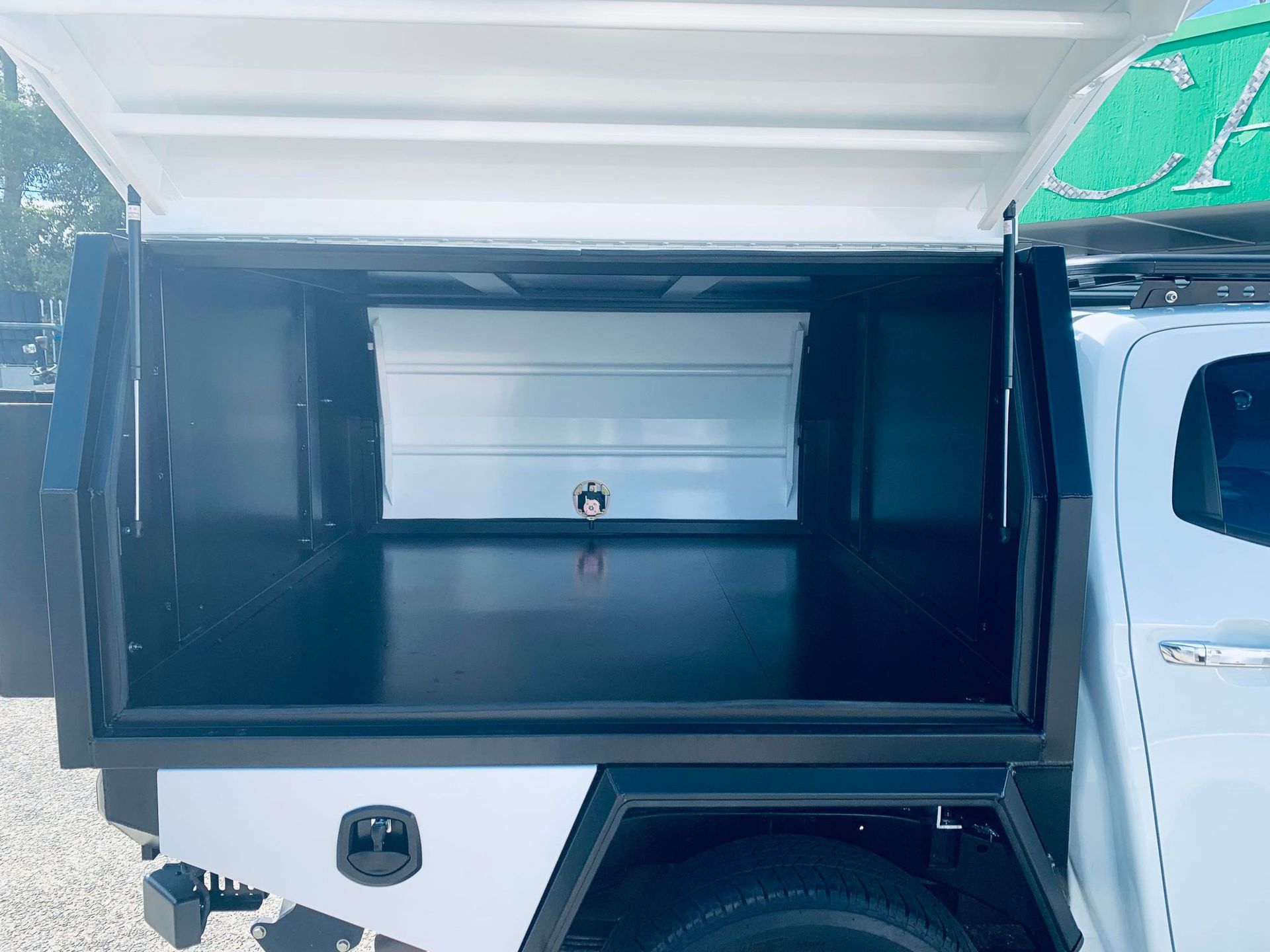 Open Truck Bed With a White Canopy and a Center Storage Box — PT Canopy In Slacks Creek, QLD