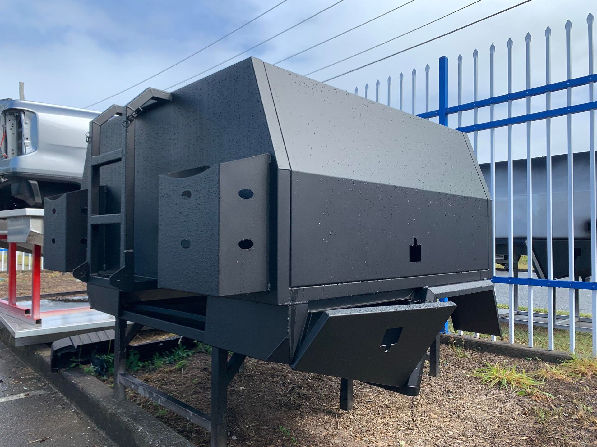Black Utility Trailer With Multiple Compartments and Doors Parked Outdoors — PT Canopy In Slacks Creek, QLD