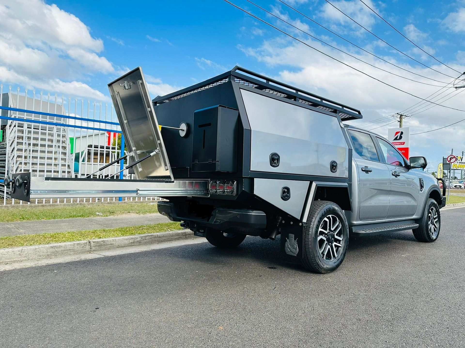 Gray Ford Truck With a Custom Camper Unit Parked on a Road — PT Canopy In Slacks Creek, QLD