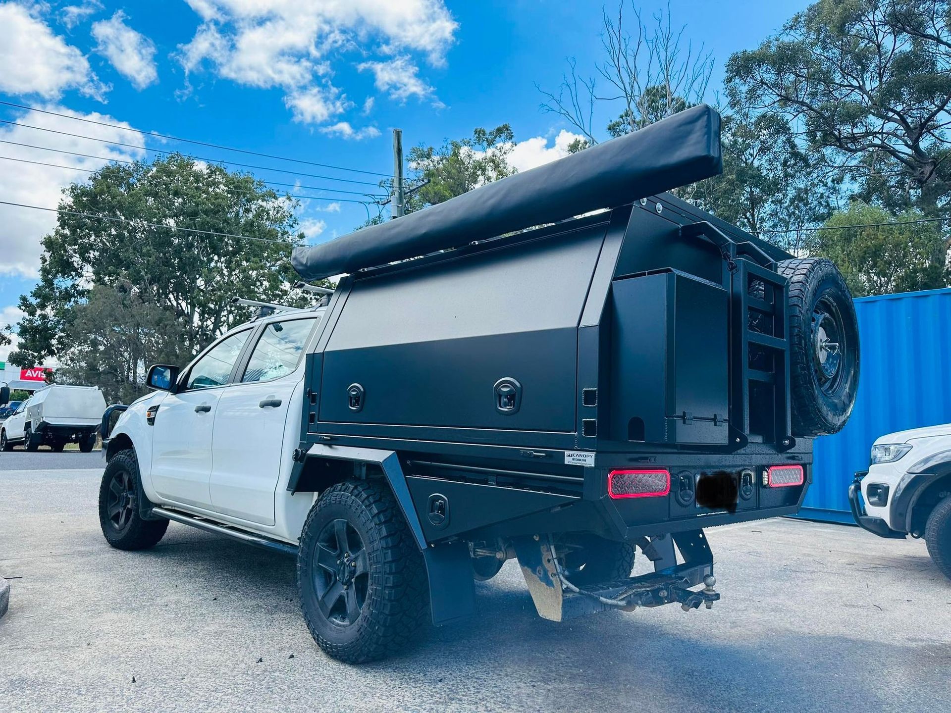 White Truck With Black Utility Tray and Canopy, Awning, and Spare Tire — PT Canopy In Slacks Creek, QLD