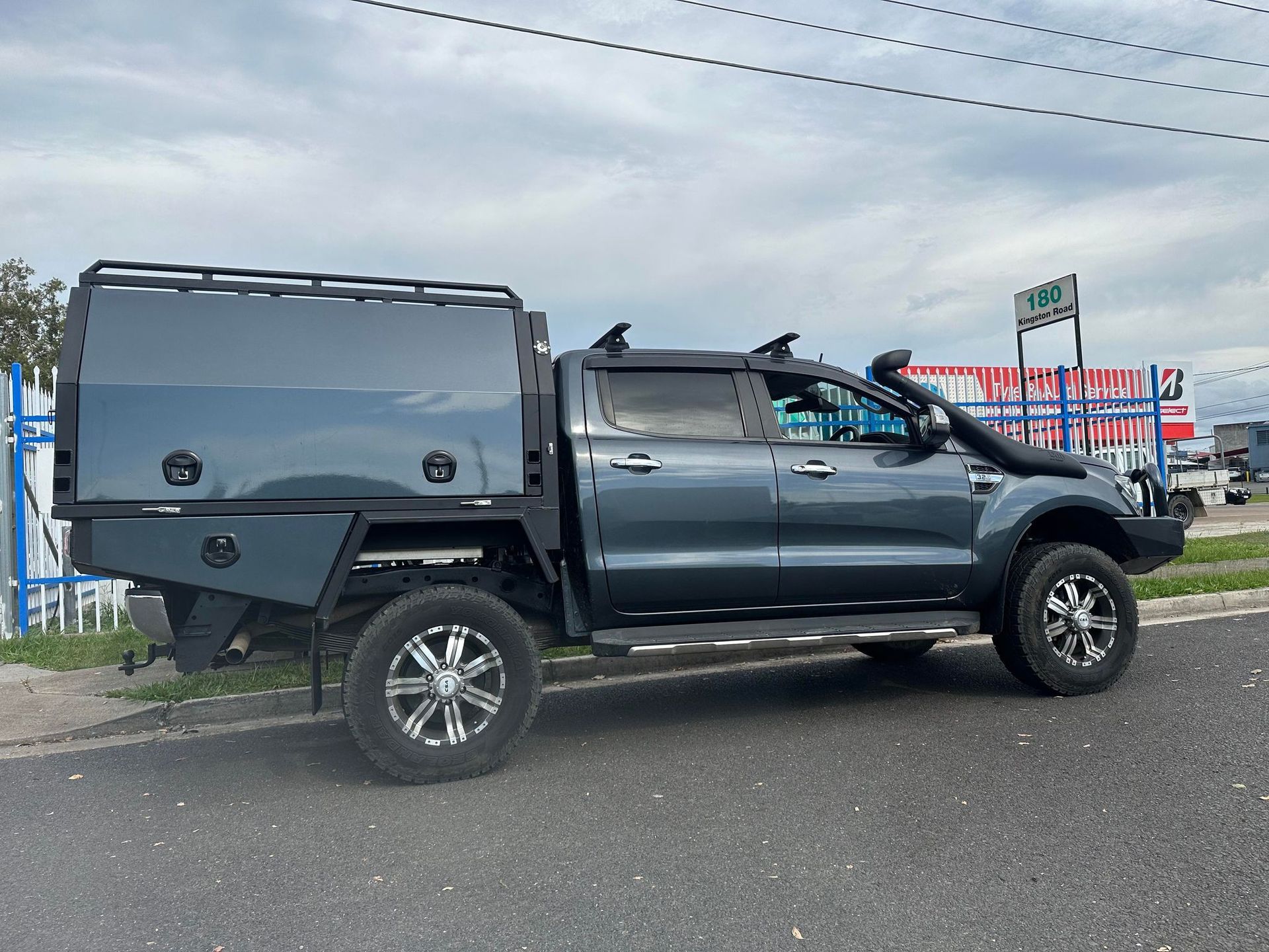 Gray Ford Ranger Truck With a Custom Camper, Roof Rack and Off-road Modifications — PT Canopy In Slacks Creek, QLD