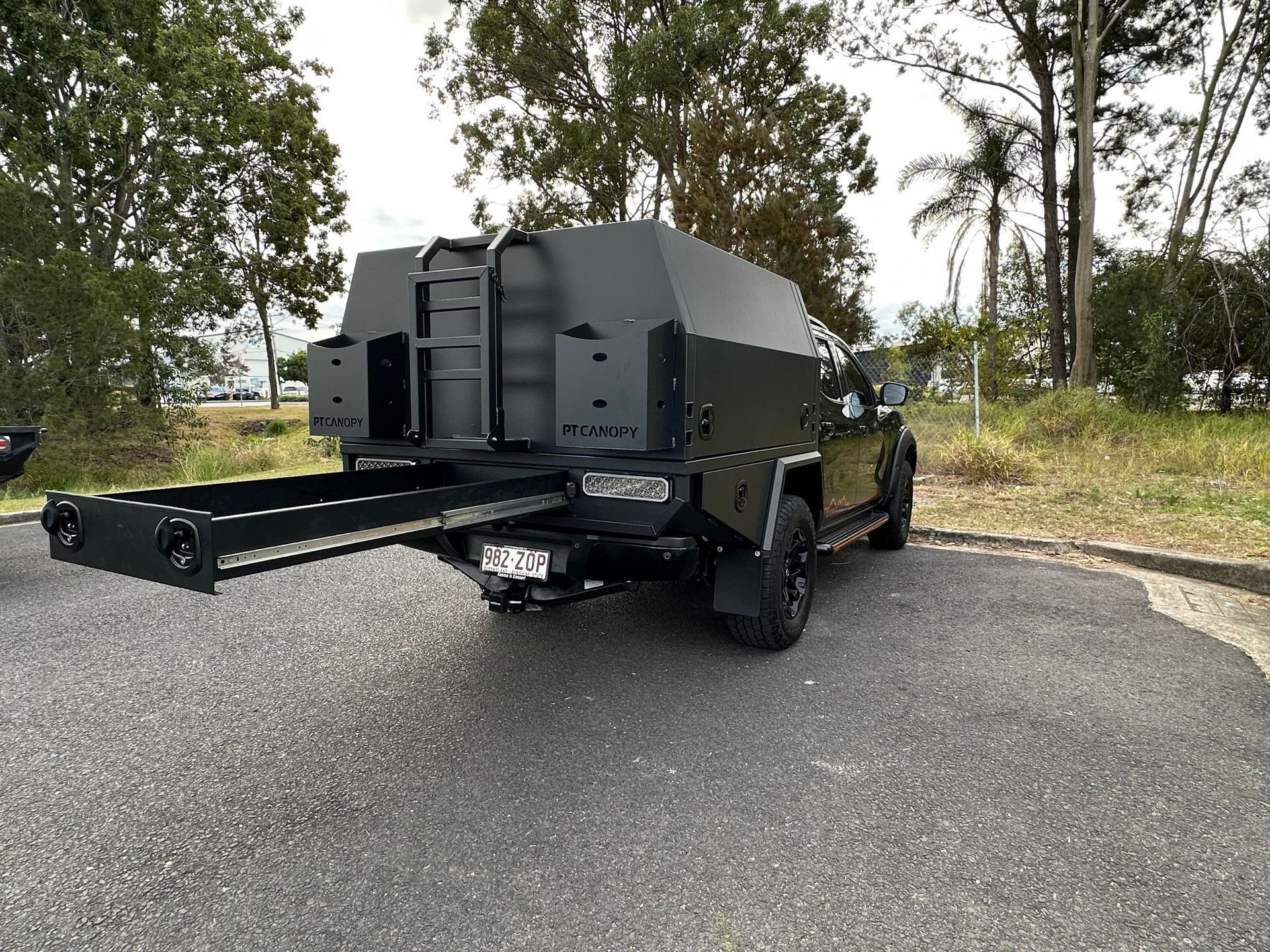 Black Truck With a Camper Setup, Parked on an Asphalt Surface — PT Canopy In Slacks Creek, QLD