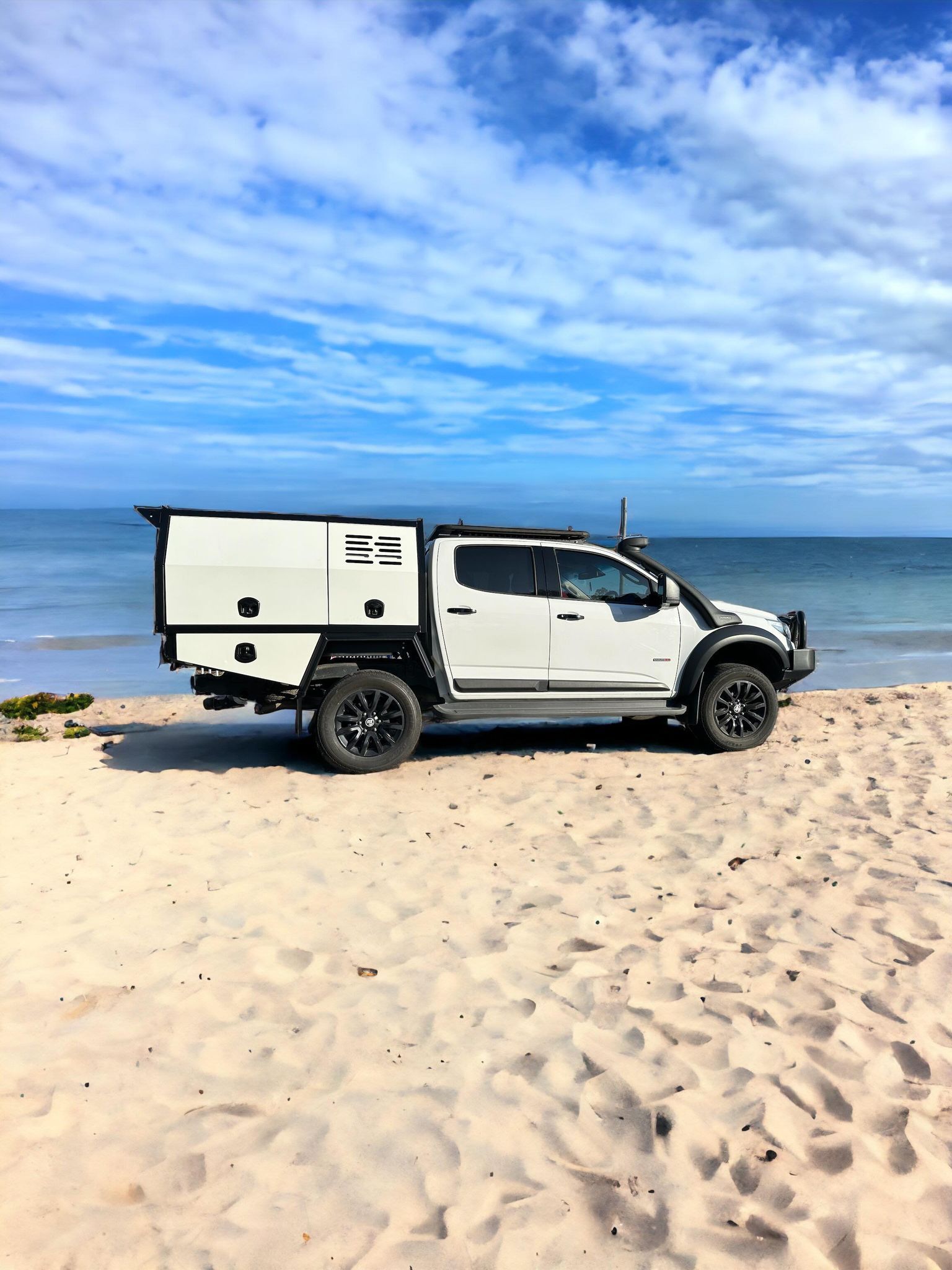 White Utility Vehicle With Black Accents Parked on a Sandy Beach — PT Canopy In Slacks Creek, QLD