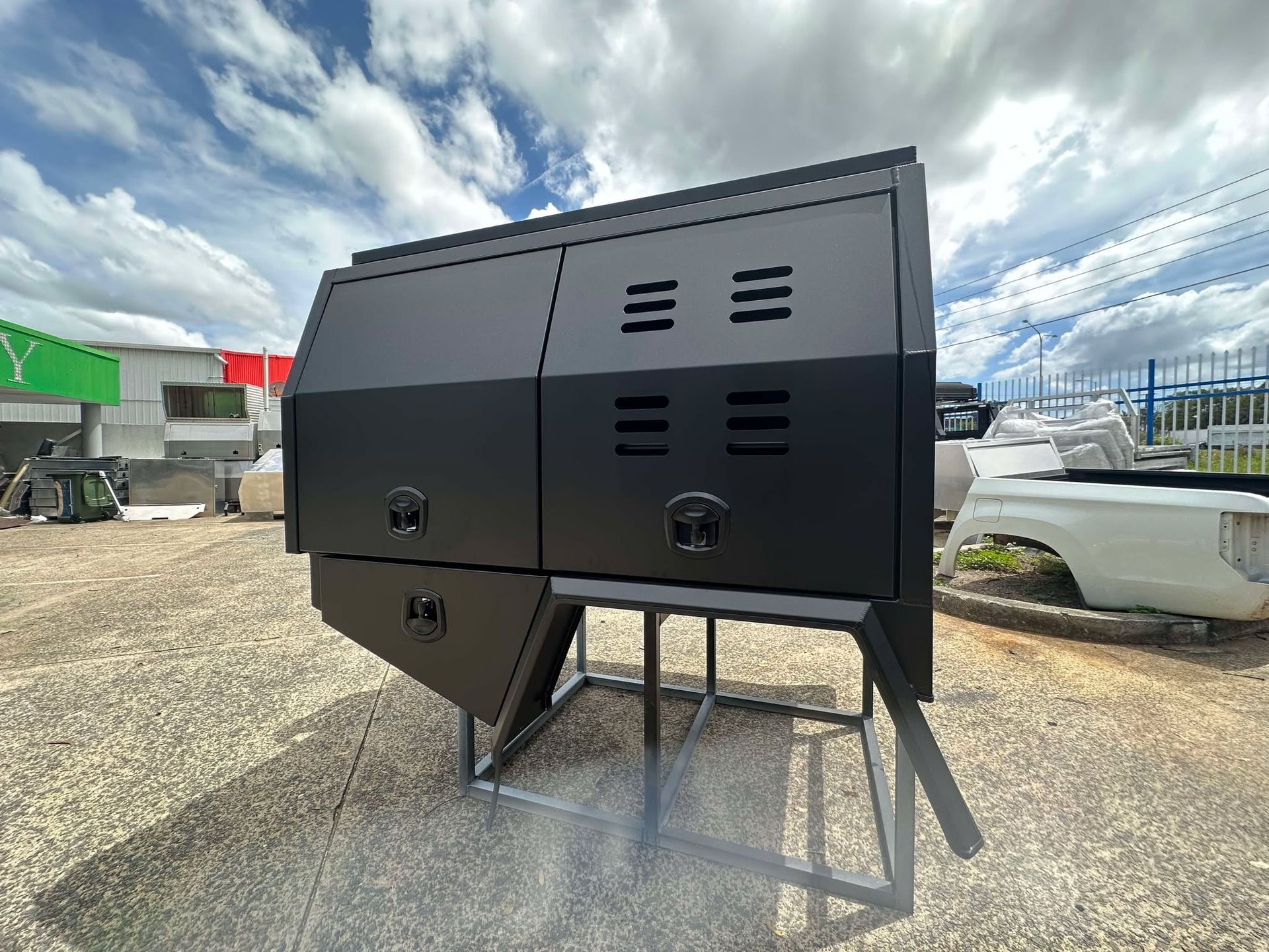 White and Black Truck Toolboxes Displayed on a Floor — PT Canopy In Slacks Creek, QLD