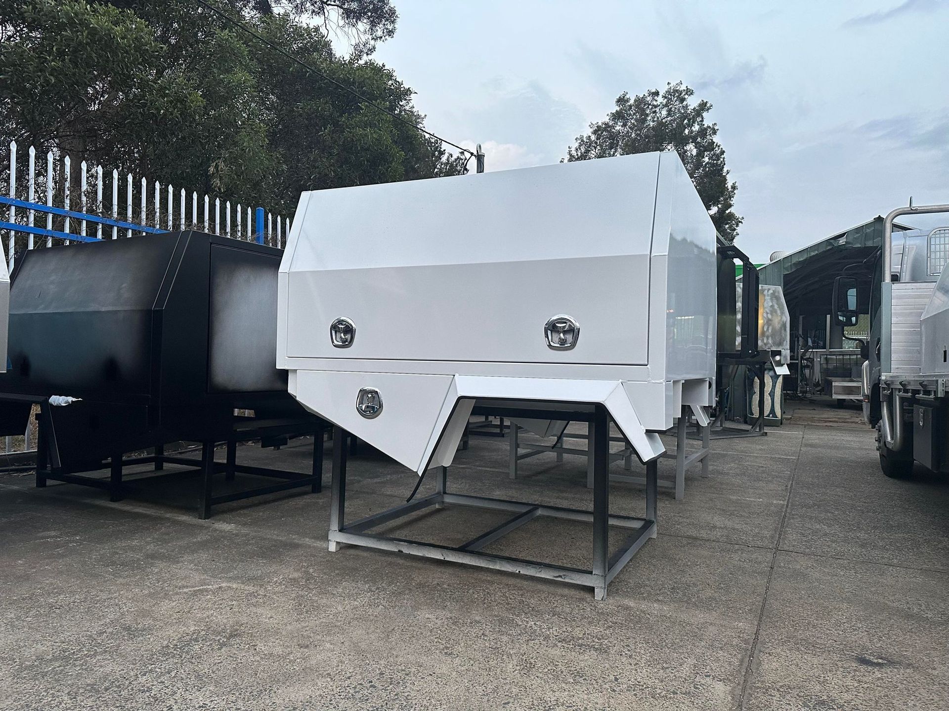 White Truck Canopy on a Metal Frame Outdoors — PT Canopy In Slacks Creek, QLD