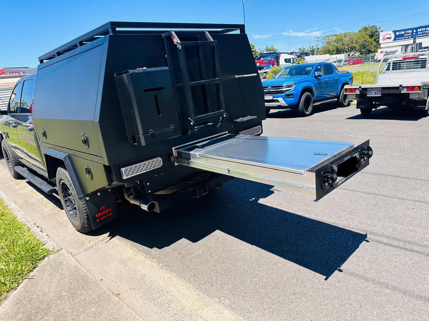 Black Truck With an Extended Camper Shell Featuring a Pull-out Tray — PT Canopy In Slacks Creek, QLD