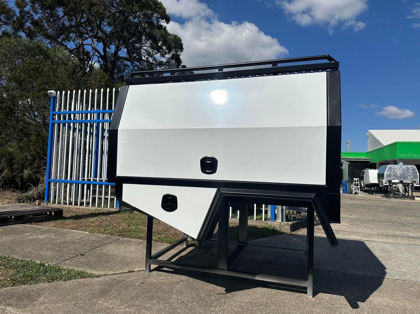 White and Black Utility Canopy on a Black Metal Stand — PT Canopy In Slacks Creek, QLD